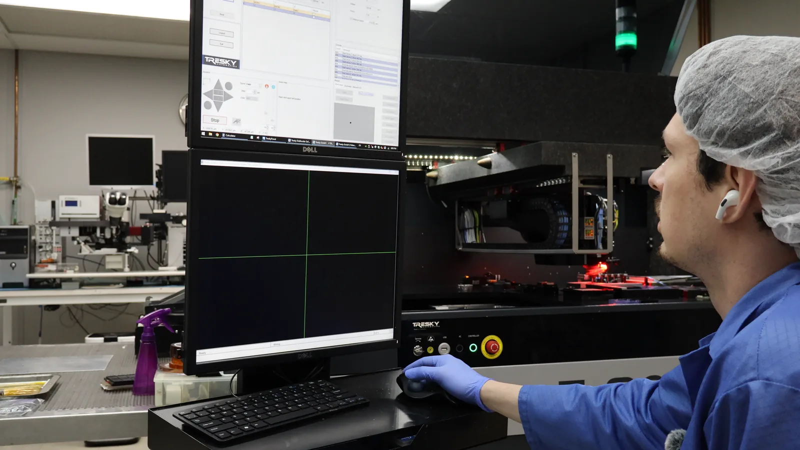 Heisler operator running an optical inspection station with the die-map readout on screen