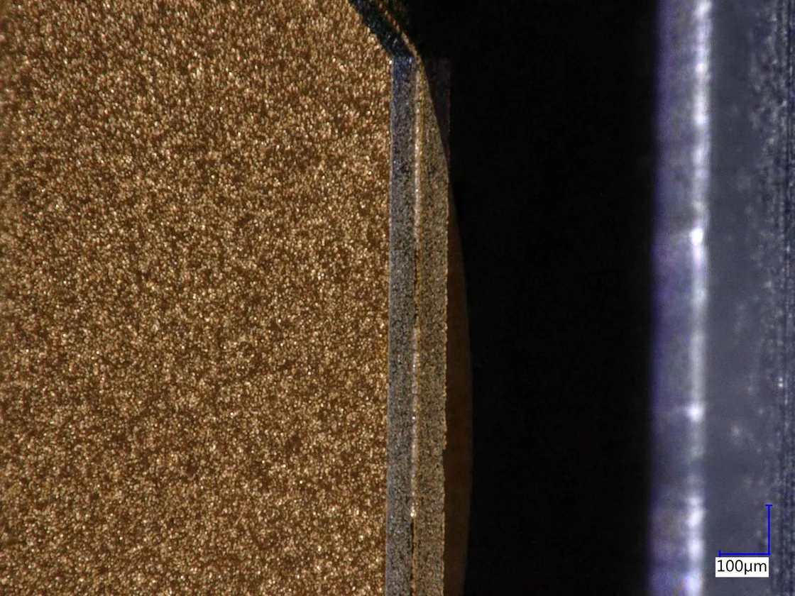 Macro cross-section of a die edge and substrate interface