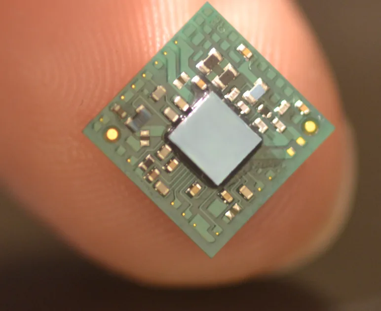 Miniaturized sensor module with a central die and surface-mount components on a fingertip
