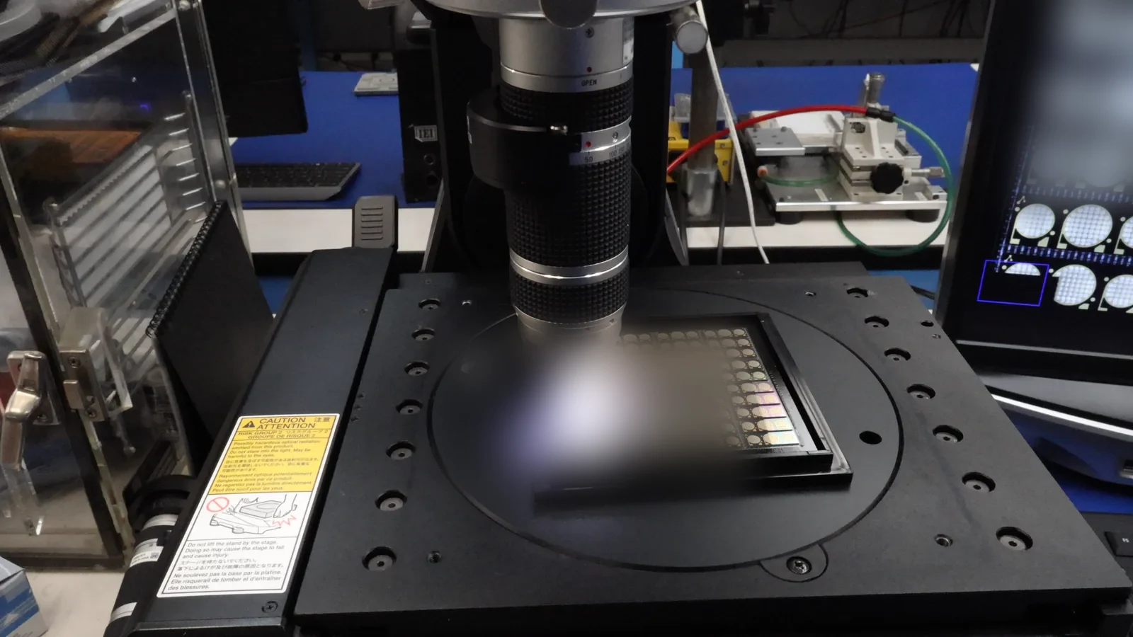 Keyence VHX-7000 digital microscope inspecting a panel at the Heisler Semiconductor inspection station