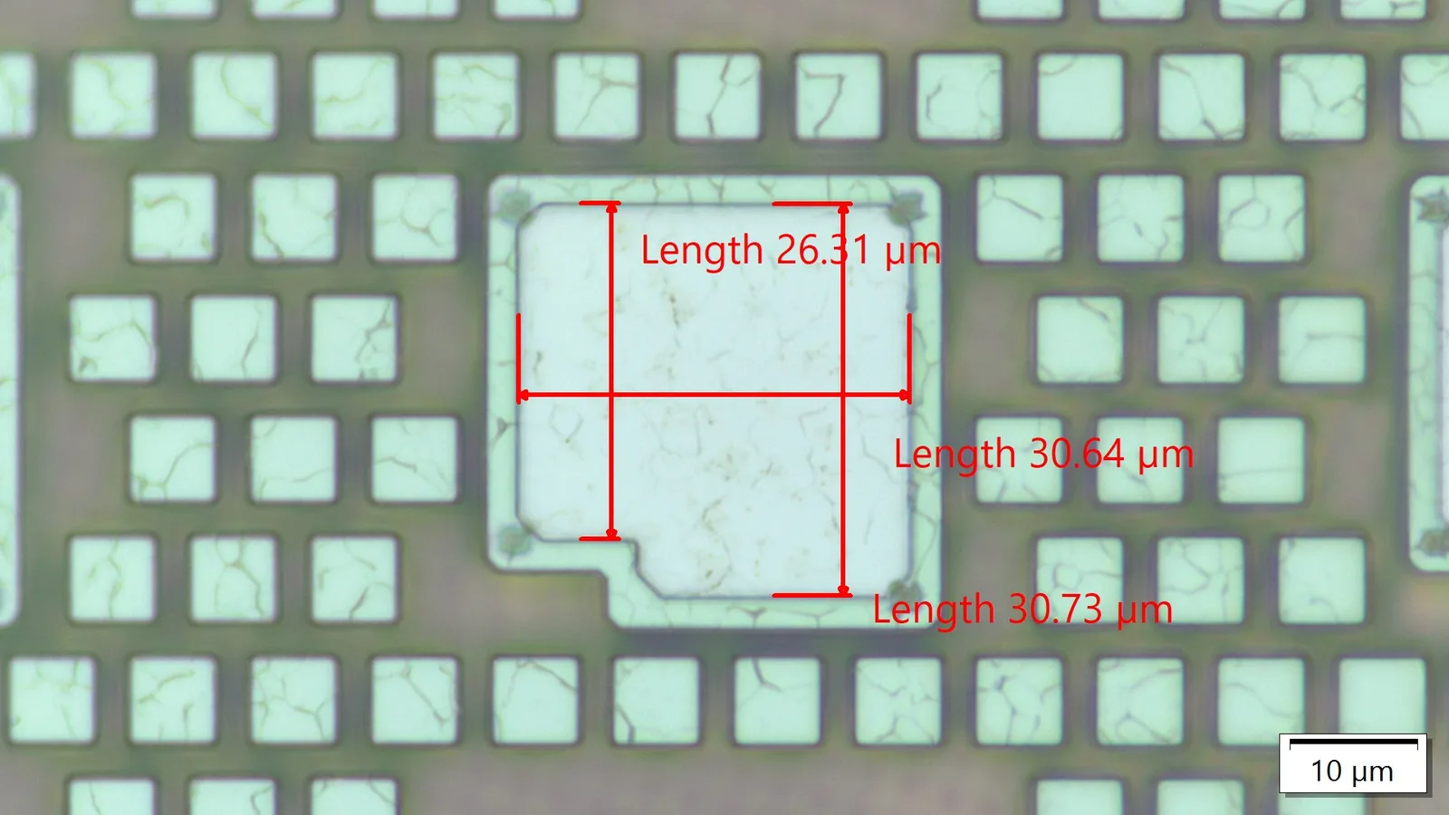 Die bond pads measured under optical metrology with micron-scale dimensional callouts